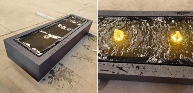 El polvo cubrió la fuente de agua de acero suave del rectángulo del jardín de la capa freática negra del metal