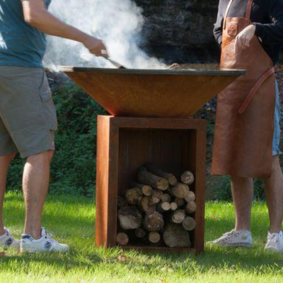 Fuego de acero aherrumbrado Pit Outdoor With Wood Storage de la altura el 100cm Corten