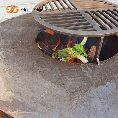 La BARBACOA de Rusty Color Outdoor asa a la parrilla al fumador del carbón de leña con la placa de cocinar del diámetro el 100cm de la ronda